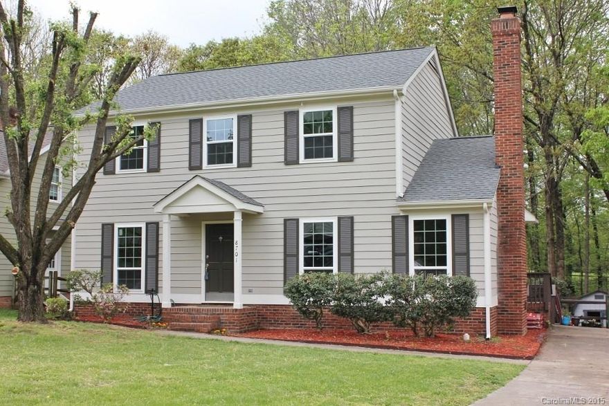 This stunning home has all the upgrades today's buyers want. Totally renovated with modern colors and finishes. New kitchen cabinets, granite counters, subway tile, stainless steel appliances and range hood. Huge master bedroom, on-suite luxury bath w/dual vanities, and walk-in closet are a rare find in this price point. All new energy efficient windows, roof, and exterior paint. Fenced, wooded yard for privacy yet backs to golf course.  Shows like a model home. You will not be disappointed!