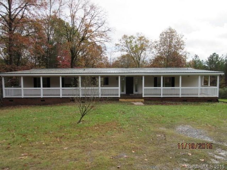 Manufactured home with full front porch situated on ten acres. Privacy within minutes of I-77.