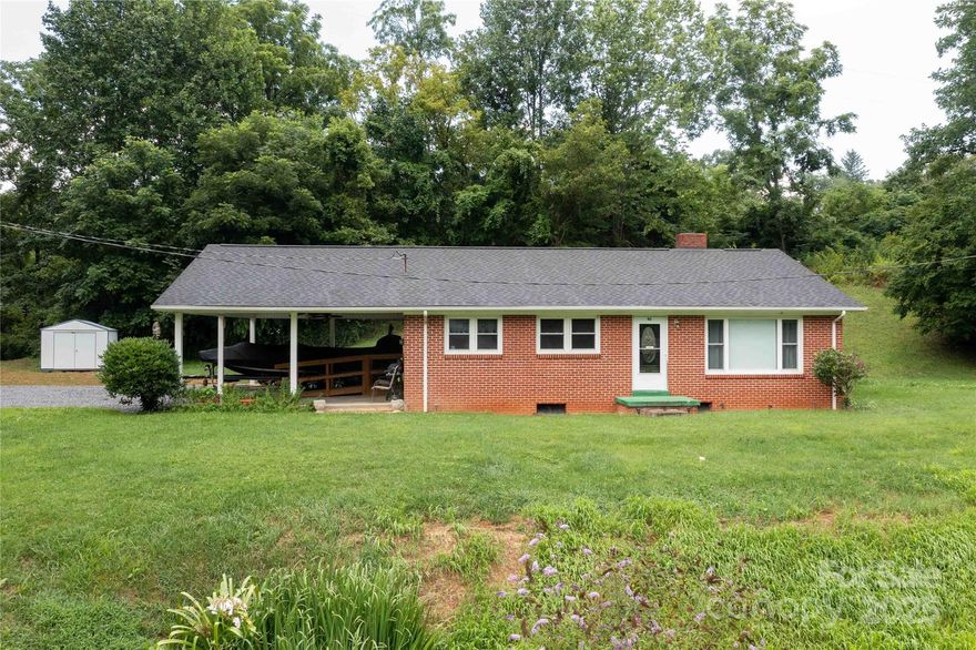 This charming 3-bed, 1-bath brick home is designed for both comfort and convenience, and comes with a burbling creek on one side of the property. Featuring a full basement and some brand-new appliances, it is ready for your personal touches! The cozy kitchen makes meal prep effortless and enjoyable, with dining area for family meals. A full basement provides endless potential—whether you envision a home gym, entertainment space, extra storage, or the opportunity to finish it into additional living space. Sit and listen to the burbling sound of the creek from your bedroom window while drifting off to sleep. With its classic brick exterior, this home offers both durability and curb appeal, requiring minimal upkeep. Perfectly located near national parks and the BRP, as well as easy shopping, this home is also within easy commuting distance of Asheville, giving you access to both peaceful living and vibrant urban amenities. Don't let it slip by, and book your private showing today!