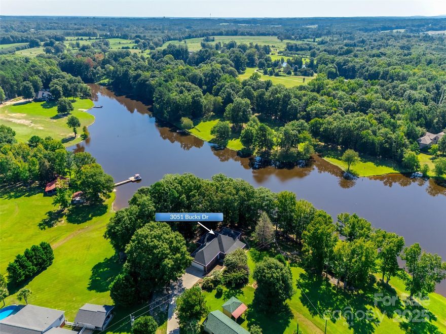 MAJOR PRICE REDUCTION ON THIS BEAUTIFUL WATERFRONT PROPERTY!!!!  REDUCED $50,000!!!!! WHAT?????
This is no Trick...Just a wonderful Treat.  Bring your Boats, Bring your Jet Skis, Bring your fishing poles. Paradise Found… This magical, one-of-a-kind property offers the rare opportunity to live on the pristine Bear Creek Reservoir. This is a private lake where only homeowners have access. An all-brick ranch nestled on 1.56 acres, this home is surrounded by all the creations of this earth—sun, moon, forest, and lake. With approximately 260 feet of private waterfront, a floating pier constructed of durable ipe wood and aluminum, a small deck, and a boat ramp.  Enjoy the lake in front of you and the beauty of the environment surrounding you.  Inside, discover thoughtful upgrades throughout: plantation shutters, a spacious 12x28 screened porch with pet-friendly screening and stunning water views, and a large 2-car garage with 9-foot ceilings. Abundant natural light fills the home through front windows overlooking the water, highlighting the commercial-grade laminate flooring. Additional features include 2 attic storage spaces and a crawl space with a moisture barrier and dehumidifier. Recent updates bring peace of mind with a new roof (2024), PEX plumbing and ductwork (2023), a leaf guard system, and a KitchenAid stove with downdraft. Outdoors, immaculate landscaping showcases rare plants, complemented by a 12x24 wired outbuilding with double doors—perfect for a workshop or storing a riding mower. Enjoy what nature offers where eagles soar, herons wade, and deer roam—yet you’re still close enough to town for convenience. Secluded, peaceful, and surrounded by nature’s best, this isn’t just a home… It's a lifestyle.