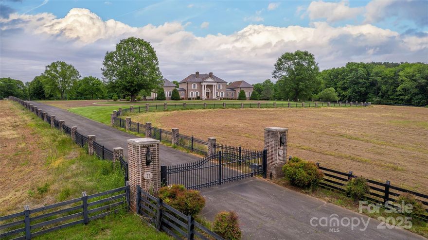Step into a world of luxury at the former executive estate of a NASCAR legend, nestled in the picturesque town of Hamptonville. This stunning property encompasses everything you'd expect from a premier country retreat, offering both elegance and comfort. Beautifully designed pool house, perfect for leisurely afternoons spent lounging by the water. Guests will feel right at home in the charming guest house, which provides a cozy getaway for friends and family. The dedicated race shop is a dream come true for racing enthusiasts or hobbyists, equipped with everything needed to service cars and motorcycles. Additionally, the farm shop offers ample space for those who enjoy woodworking, crafting, or tending to the land. The property is dotted with numerous barns, each adding character and utility, along with vast pastures waiting to be explored. Embrace the tranquility of country living while enjoying the conveniences of modern luxury.