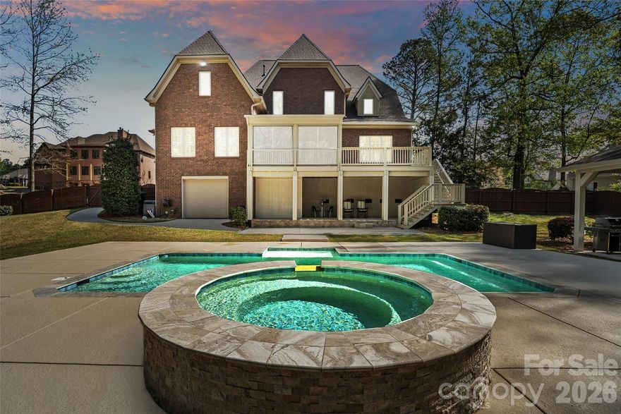 Welcome to a truly exceptional estate where luxury, craftsmanship, and peace of mind come together seamlessly. Perfectly positioned on a private 1-acre homesite, this impressive 5,300 square foot residence has undergone an extensive, top-to-bottom transformation—offering the rare opportunity to own a home that lives like new while delivering timeless architectural character.
From the moment you arrive, the property’s presence is undeniable. Mature trees have been thoughtfully cleared to enhance both curb appeal and natural light, while upgraded driveway lighting and meticulous drainage improvements ensure both beauty and functionality. Inside, the entire home has been freshly painted, creating a clean, sophisticated canvas that complements any style.
Designed for both comfort and convenience, the home features a private elevator, effortlessly connecting all levels—ideal for multi-generational living or simply elevating everyday ease.
At the heart of the home lies a completely reimagined chef’s kitchen, outfitted with high-end appliances including a premium gas range, designer refrigerator, new countertops, an expansive island, custom-finished cabinetry, and a striking backsplash. Every detail has been curated to blend elegance with performance.
The bathrooms have been fully refreshed with modern fixtures, updated lighting, new countertops, mirrors, and toilets, while the luxurious primary suite showcases a completely rebuilt walk-in shower—creating a spa-like retreat.
Beyond aesthetics, this home offers unmatched structural and mechanical upgrades for long-term confidence. A brand-new roof with enhanced flashing and metal accents, encapsulated crawlspace with dehumidifier, new insulation, vapor barrier, and reinforced structural elements ensure efficiency and durability. The well system has been fully modernized, and an advanced irrigation system with 60 new sprinkler heads and rain detection keeps the grounds lush year-round.
Step outside to discover a true resort-style outdoor retreat. The backyard is anchored by a fully rebuilt resort-style pool and spa, complemented by an inviting cabana—creating the ultimate setting for relaxation and entertaining. A newly constructed pavilion with fans, lighting, and a wood-burning fireplace enhances the experience, while the enclosed sunroom offers year-round enjoyment overlooking these beautifully designed outdoor living spaces. The pool deck has been completely replaced with temperature-sensitive finishes, and all surrounding drainage has been thoughtfully engineered for long-term performance.
Car enthusiasts, hobbyists, and those needing extra storage will appreciate the exceptional garage setup. The home features an oversized 3-car attached garage with new motors and battery backups, along with a separate 4th garage at the rear of the property—perfect for lawn equipment, tools, a workshop, or additional storage.

Additional highlights include:
• Fully sealed and insulated garage spaces with new doors, motors, and battery backups
• Comprehensive security system with cameras and smart features
• New LED lighting throughout the property, including exterior and driveway illumination
• New gutters and drainage systems directing water safely away from the home
• Finished and insulated attic spaces adding usable square footage and efficiency
• New fencing enclosing the pool area for privacy and safety

Every inch of this property has been thoughtfully improved—combining luxury finishes with critical infrastructure upgrades that are rarely found in one offering.

This is more than a home—it’s a fully realized estate designed for those who value quality, privacy, and effortless living with its close proximity to all that Indian Land has to offer from restaurants, shopping, recreation and schools. Millstone Creek is conveniently located just across Hwy 521 from the Indian Land High School making those early mornings easy for your student.