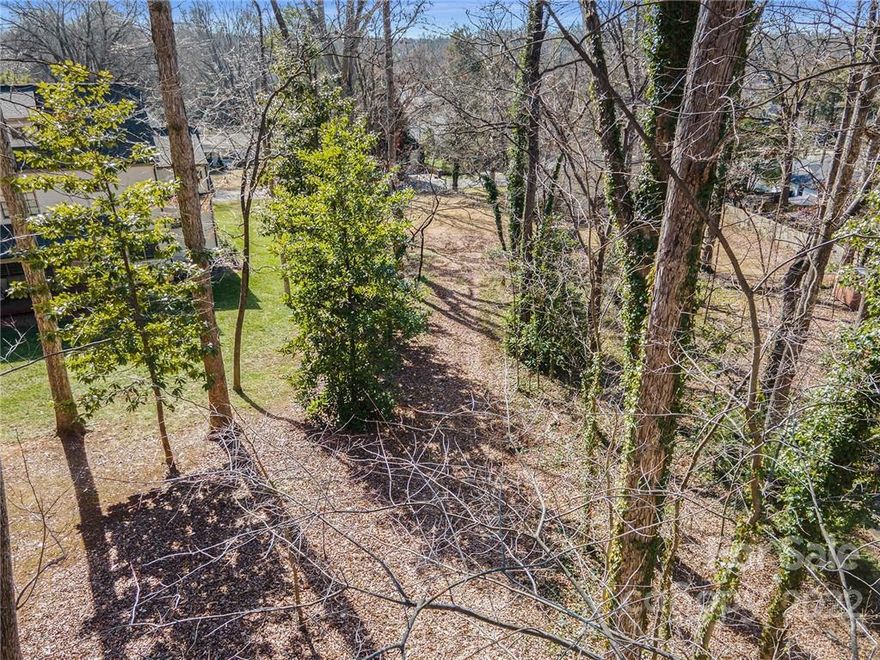 This is your chance to build your own Estate--right in Cotswold, in the heart of Charlotte.  You don't find opportunities like this very often.  These two parcels make up 1.95 acres and both parcels are included in the price.  Million dollar houses popping up all around this area.  You can access the property from Tangle Drive or use the parcel on Windermere to create an entrance.  Optional Charlotte Swim and Racquet club just a block away.  Uptown Charlotte is just 15 minutes away and Cotswold Mall is one mile away with great shopping and restaurants.  This could be the one.