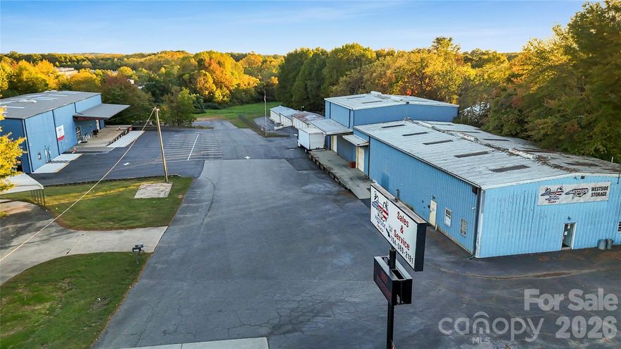 Exceptional commercial property with strong value-add potential.  Zoned LI which covers many different types of businesses, including manufacturing. Close proximity to I40 and I77. 4.43 acres of land with two +/ - 7,500 sq ft warehouses. Additional land on-site perfect for additional buildings/outdoor storage. Ample parking. There are 15 - 10x10 storage units and 30 - 5x10 storage units that creates a sturdy investment opportunity.  Proforma income on the storage units alone is $3k month. Each warehouse has built out office space that’s heated and cooled. Both buildings have a men's and women's restroom and break room. Loading dock on each building with 2 roll up doors on each. Good clear height in the warehouses. Building #2 has been completely renovated from the office space and kitchen to the showroom.  There is ample opportunity here for an investor only or for an owner-operator that wants to occupy space and lease the additional space. Owner financing potentially available with agreeable down payment and terms.