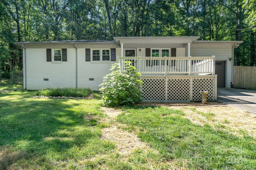 Beautifully renovated home in a prime location, situated on nearly an acre, just minutes from shopping centers and restaurants. This property boasts numerous upgrades, including a new HVAC system, windows, luxury vinyl plank flooring, fresh paint inside and out, a garage door, kitchen cabinets with granite countertops, stainless steel appliances, updated light fixtures throughout, and many more new features.