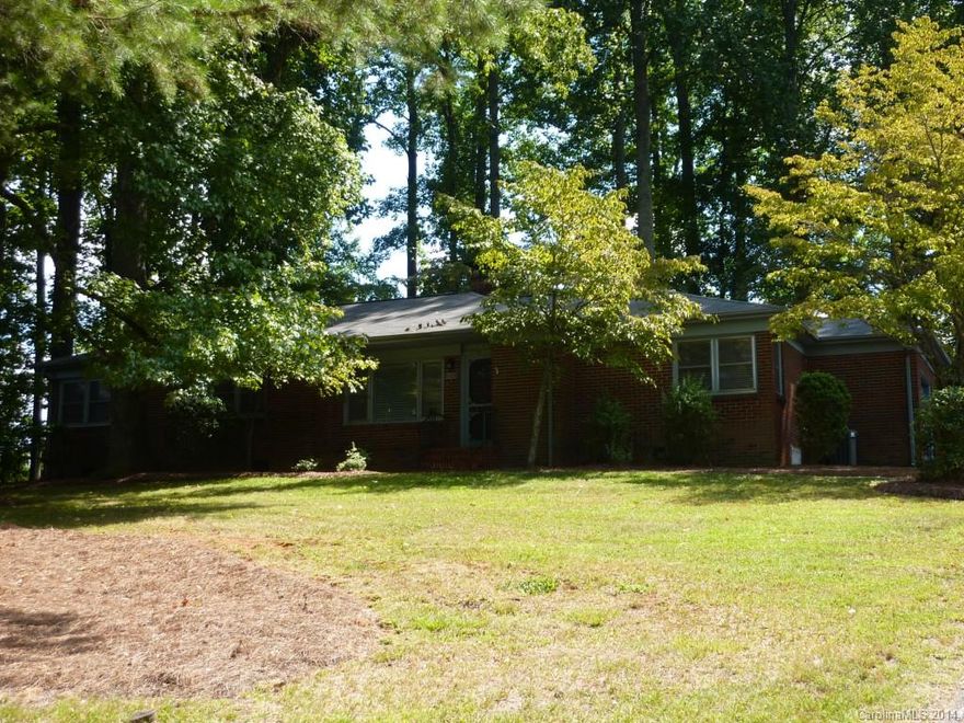 This 4 bedroom/1.5 bath all brick ranch is across the street from a beautiful pond and sits on just over a half acre wooded private lot. Hardwood floors in all living spaces and bedrooms except kitchen and bath. One car garage as well! This home had been well maintained by the original owners and have done the following recently: replaced roof 2009, replaced water heater 2009, updated plumbing in 2008, replaced thermostat in 2012. Great location near I-85, I-77, 485 and UNCC. Come take a look!