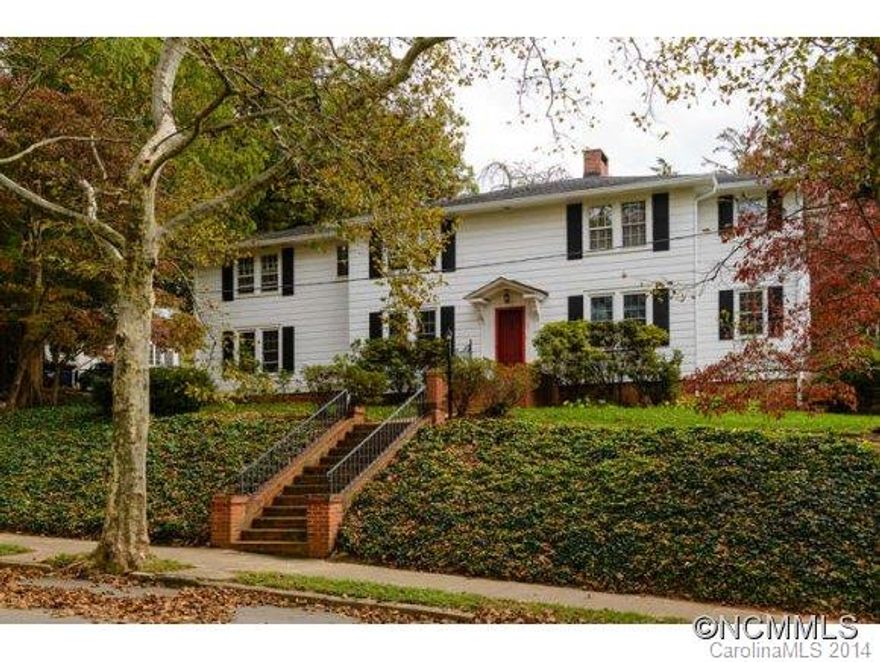 GROVE PARK!  This 4BR,2.5BA home has many updates and upgrades.  Hardwoods throughout, SS appliances, gas cooking, Silestone counters and lots of cabinets in the large kitchen which opens to formal DR, LR and FR.  Sitting room is perfect for relaxing or a 1st floor office.  Large bedrooms and huge master bedroom with cozy fireplace.   A completely enclosed courtyard with stone fountain and built-in grill is the perfect space for entertaining.