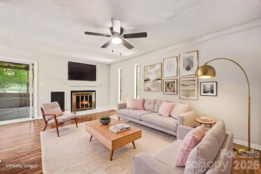 NEW Price, NEW Carpet, Freshly painted and move-in ready, this inviting end-unit townhome in desirable Raintree offers comfort, convenience, and strong investment potential. Enter through a gated private courtyard that sets the tone for relaxed living. Inside, a spacious floorplan features an updated kitchen with all appliances, ample cabinet and counter space, and a pass-through to the dining area with built-ins. The great room showcases a cozy wood-burning fireplace, New Ceiling Fan and sliding glass doors that open to a large covered private patio, perfect for relaxing or entertaining. The main level includes a bedroom and full bath, ideal for guests or flexible living. Upstairs, the oversized primary suite offers Dual closets and updated bathroom with NEW tile tub-surround. Additional highlights include a conveniently located kitchen laundry closet, abundant storage throughout, and exterior storage closets off both the front and back patios. Enjoy walkable access to nearby restaurants, shopping, and everyday conveniences. Two assigned parking spaces are just steps from the front door. Located in a highly sought-after South Charlotte area with top-rated schools, this home is an excellent opportunity for investors or buyers looking to secure a property in a prime South Charlotte location. Raintree Country Club initiation fee waived.
