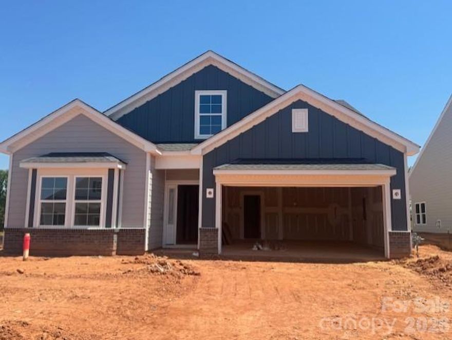 Grand Opening Pricing! The Durham II is a one and a half story home featuring four bedrooms and three bathrooms. The kitchen is open to the great room which boasts a natural gas fireplace.  The upgraded kitchen includes an island with breakfast bar, quartz countertops, upgraded cabinets along with a spacious eat in area. The primary suite is just off the great room and features a linen closet, water closet, and large walk-in closet. Primary bath includes a walk-in tiled shower and dual sinks.  Two secondary bedrooms are located at the front of the home, and each have a walk-in closet. An upstairs guest room has a private closet and ensuite bathroom! The garage entry is tucked away with a conveniently located coat closet, giving easy access to the full garage. Enjoy outdoor relaxation on your spacious covered porch. Visit to discover the small town feel of historic Shelby! Also, Willowbrook is conveniently located an hour from Charlotte and an hour and a half from Greenville, SC and Asheville, NC.