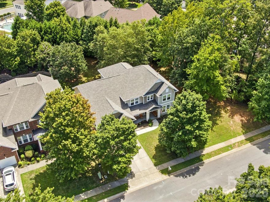 **Seller is offering a $5,000 CREDIT TO BUYER at closing with acceptable offer** 
Welcome to this beautifully appointed 4-bedroom home with a huge bonus room in the sought-after Lawson community! **NEW wood flooring on the main level – November 2025!**  The primary suite is conveniently located on the main level and features a renovated spa-like bath with a clawfoot tub, frameless glass shower with gorgeous tile, and a massive walk-in closet. The spacious kitchen boasts granite countertops, tile backsplash and flooring, a huge island, and a butler’s pantry - perfect for entertaining. The open floor plan highlights soaring ceilings in the foyer and great room, while the dedicated office with sliding glass doors provides the ideal work-from-home setup. Upstairs, you’ll find newer LVP flooring, a renovated bathroom with dual access from the bedroom or bonus, plus a walk-in attic for easy storage. Additional features include dual staircases, a roof replaced in July 2024, and an oversized 2-car garage.
Outdoor living shines here with a rocking chair front porch, spacious patio, and a custom paver firepit with knee-wall, ideal for gatherings. All of this in Lawson - a community known for its resort-style amenities, including a clubhouse, fitness center, pools, tennis courts, playgrounds, walking trails, and more.