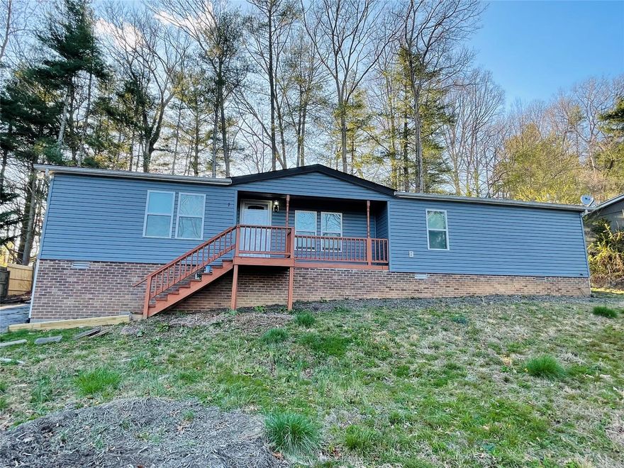 BACK ON THE MARKET! Great starter home in Mills River! 3 bedrooms, 2 baths, split bedroom plan. Large living room area with separate dining room. Large back deck. Update it the way you want it!