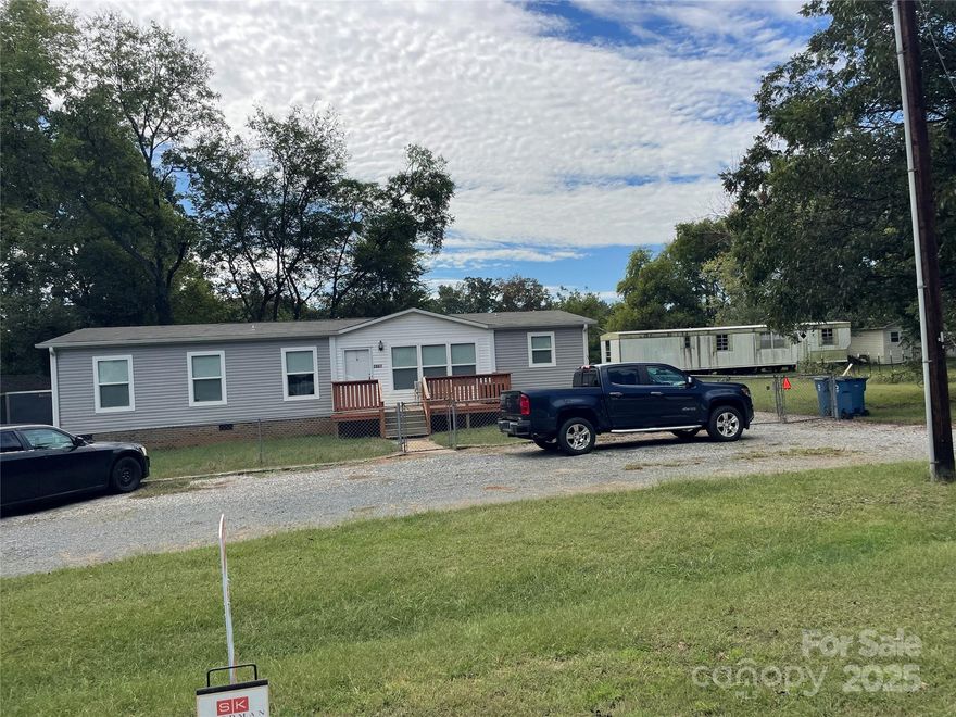 Welcome home to your new house, no HOA, city water and septic system keep the utility bills low on this maintenance free home.  Fenced in yard and storage galore with 3 nice sheds in back yard.  Home is new with 2020 construction.  Open floor plan and huge living room and kitchen with island make this the one to call home.  Great schools close by in Harrisburg.
Fenced in yard, nice one car garage in back.  Owner is removing older sheds in back currently.