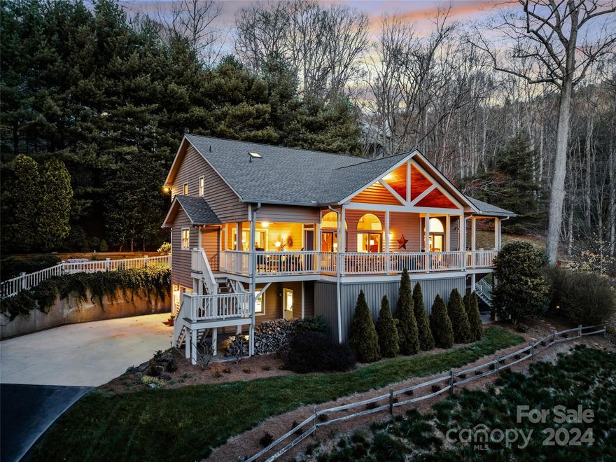 Extraordinary private oasis nestled in Sondley Estates, one of Asheville's most prestigious communities. Encompassed by breathtaking mountain views, captivating landscapes & hardscapes, this exceptional property offers an unparalleled lifestyle of luxury and tranquility. The heart of the home boasts a stunning floor-to-ceiling stone fireplace, creating a warm and inviting atmosphere in the living room, while oversized windows frame the majestic mountain views, bringing the outdoors in. Huge chef's kitchen w/an island/breakfast bar & much more. Retreat to the primary suite complete w/deck access and a luxurious en suite bath. Upstairs, you'll find three bedrooms, two full baths and a versatile bonus room. The lower level boasts a 2nd living quarters w/a spacious guest suite & separate entrance. Relax & unwind outdoors w/a large covered back deck, screened porch, firepit & deck with built-in benches and a wonderful side yard. There's so much to discover here! Schedule a showing today.