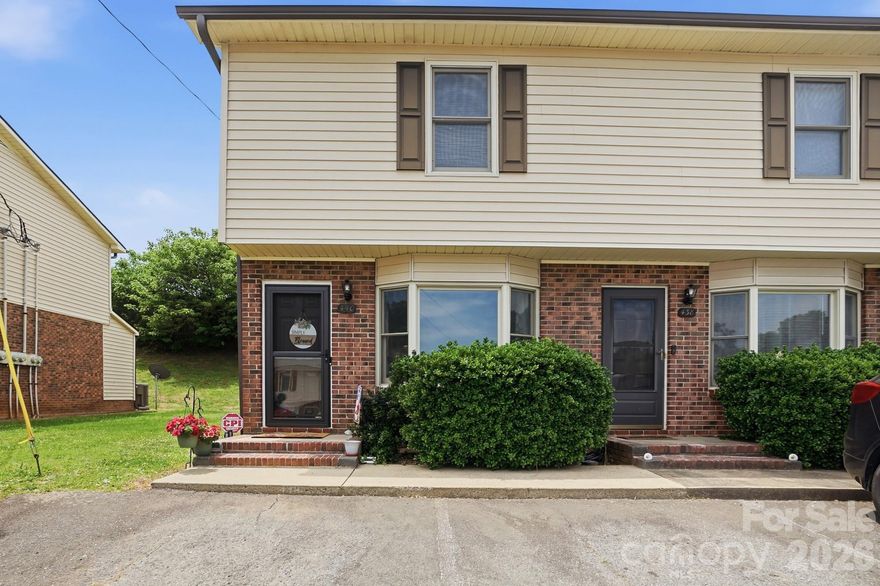 Welcome home to this charming 2-bedroom end-unit townhome offering comfort, convenience, and extra privacy. The main level features a spacious living area, dining, kitchen, and a convenient half bath for guests. The living room is highlighted by a cozy bay window view that fills the space with natural light. Upstairs, you’ll find two generously sized bedrooms and a full bath. Upgrades include new interior custom paint, contemporary vinyl flooring throughout, three ceiling fans, new HVAC, newly installed custom built-ins in bedroom closet and linen closet. The sellers have also added storm doors to both the front and rear entrances. Perfect for letting in fresh air and enjoying the Fall and Spring Carolina weather. Conveniently located near shopping, dining, and major commuter routes, this low-maintenance home is a perfect blend of comfort and elegance.