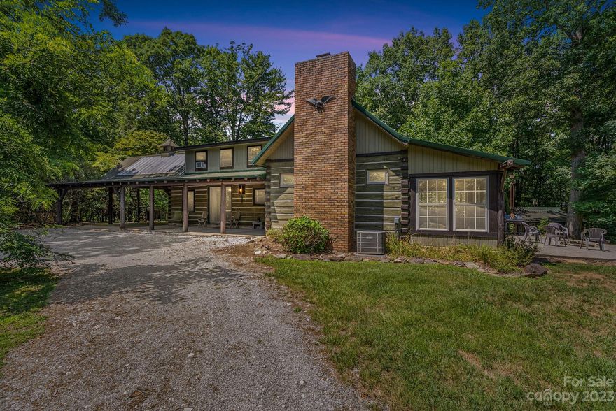 Welcome to 221 Fiddlers Lane, Mills River! This unique, rustic log cabin offers 2 bedrooms and 3 bathrooms. As you enter the 1.77 acres you will notice the privacy this property offers, while being minutes away from shopping, restaurants, and the airport. The main level of this home will make you feel like you are on vacation everyday. Cathedral ceilings, rustic beams, wood burning fireplace, and the gourmet kitchen are just a few key features. The primary bedroom and bath is on the main level. The upstairs has a loft and another bedroom and bath. There is an unfinished basement to provide ample storage and a one car garage. This property has an additional one bed, one bath studio dwelling. This could be an art studio, vacation rental, office space...the possibilities are endless. There is plenty of room to garden and enjoy nature, or take a relaxing soak in the hot tub. This home has been a successful income producing Airbnb for the last 3 years. Don't miss this one!