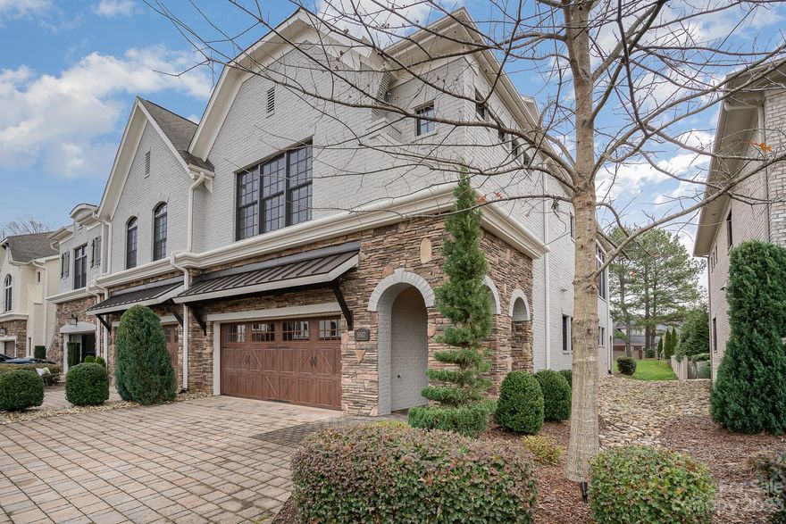 This exquisite luxury custom-built townhome in the heart of SouthPark is a must-see. An exclusive and rare find, the end unit offers a stunning green space and outdoor tranquility from your own backyard. Impeccably maintained, this unit boasts 3 floors including 3 beds, 3.5 baths and 10 ft ceilings throughout. Walk into the open-concept great room featuring an abundance of natural light including fireplace, gourmet kitchen, dining area, and entertainers island. Each of the three bedrooms offers their own on-suite bathroom. The lower level offers a bedroom, full bath and flexible living space perfect for a den, office or gym. The large 2nd level owner's suite provides a luxurious bathroom with a generous walk-in closet. The third floor hosts it's own bedroom and full bath. Enjoy the beautiful back yard from the lower level patio, perfect for entertaining, or the 2nd story balcony. Other features include a 2 car garage with epoxy flooring, two laundry spaces, and plantation shutters.