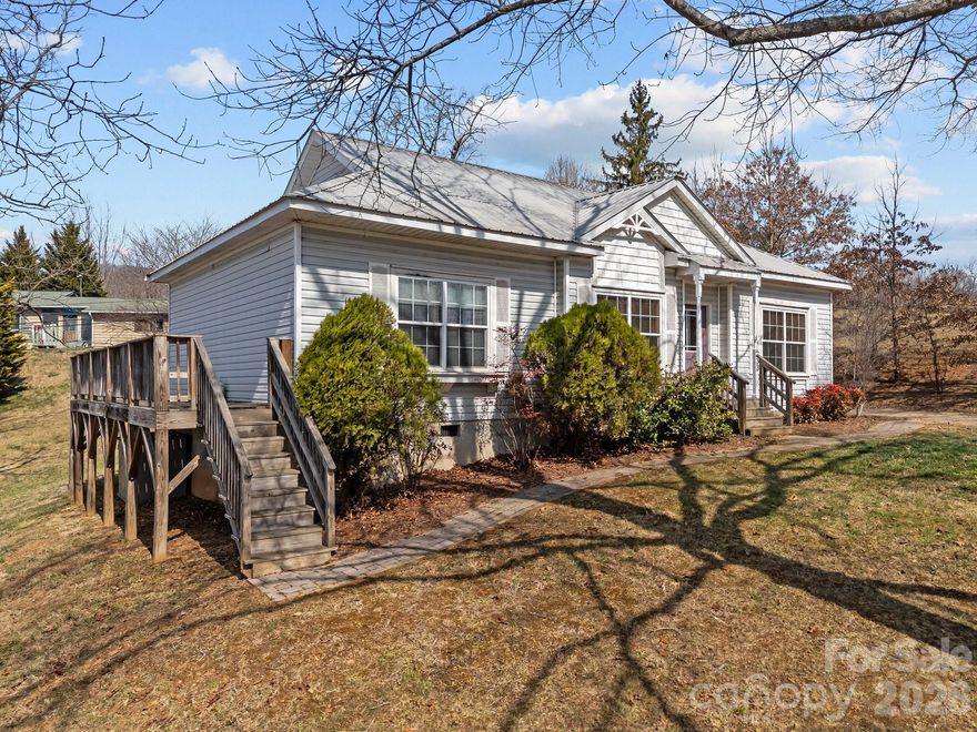 **Be sure to check out the virtual tour of this listing!**
At no fault of the sellers, this beautiful home is back on the market!  Welcome to your new home!  You aren't going to want to miss this beautiful, one level home.  This home features 3 bedrooms and 2 bathrooms along with a laundry/storage room.  Step outside to the porch that wraps around one side to enjoy grilling and outside living. Minutes away from I-40 and in between Waynesville and Canton.  You don't want to miss this home!