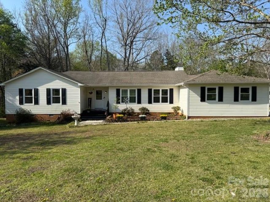 This move-in ready ranch home sits on a private 1.35 acre wooded lot, offering the perfect blend of privacy and convenience.  Inside you'll find 3 bedrooms, 2.5 baths, two spacious living rooms, a large kitchen, formal dining room, and a dedicated office/bonus room ideal for work from home or flex space needs.  
Fresh updates include new carpet 2026, new double hung windows 2025, new modernized garage door with up-to-date technology control, newly insulated and remodeled garage 2026, security system, and smart control entry for remote access and monitoring.  The home offers open flow living, generous natural light, and multiple spaces for entertaining, relaxing, or family time. The backyard feels like your own private retreat with an oversized deck, built in gazebo, fire feature, and above ground pool, perfect for gatherings, summer evenings, and outdoor fun.  Additional exterior perks include an attached two car garage, and a large RV sized carport, offering RV parking, boat parking, trailer storage, or workshop potential.  Located just minutes from I-77, this home provides easy commuting, quick access to shopping and dining, and the freedom of NO HOA. 
Bring your recreational equipment and ideas. This home checks all the boxes: privacy, space, outdoor living, updates, and convenience.