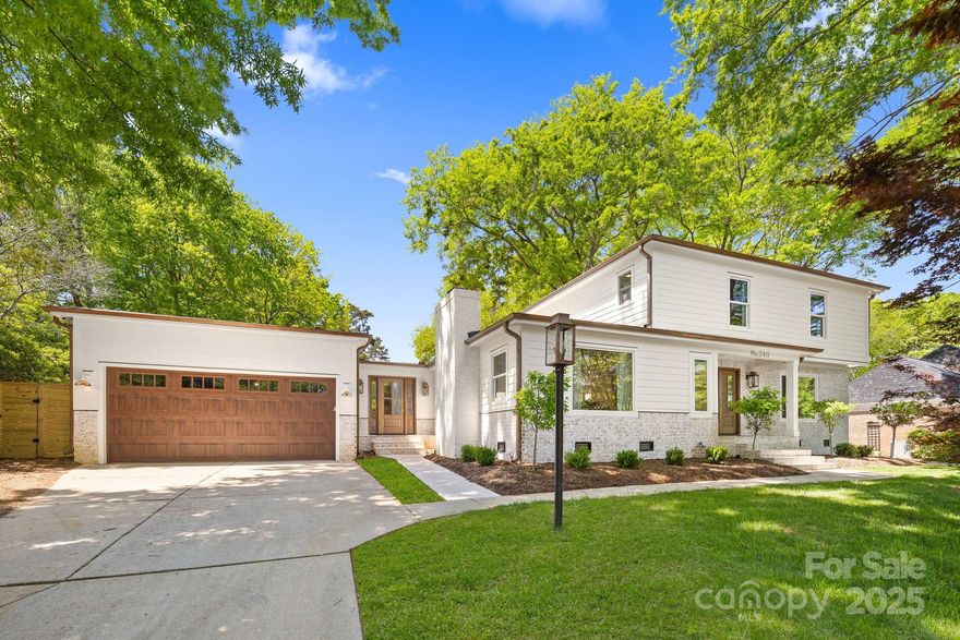 Welcome to 2411 Ainsdale Road, an exceptional, fully updated home in Charlotte’s coveted Governors Square. Meticulously renovated and move-in ready from top to bottom,  this home boasts a chef’s kitchen with white oak cabinetry, quartz backsplash, oversized island, and a pass-through window to the expansive outdoor living area. The living room flows through a four-panel sliding door to a large deck & fenced yard featuring a saltwater pool. The main floor offers formal dining, a private office, home gym, laundry, and two half baths. The luxurious primary suite offers dual walk-in closets and a spa-like bathroom with an oversized soaking tub and a curbless walk-through shower featuring dual shower heads and porcelain tile extending from floor to ceiling. Upstairs are four generously sized bedrooms and two newly updated full baths. Designer details throughout—copper gutters, Venetian plaster fireplace and range hood—complete this rare find in one of Charlotte’s most timeless neighborhoods