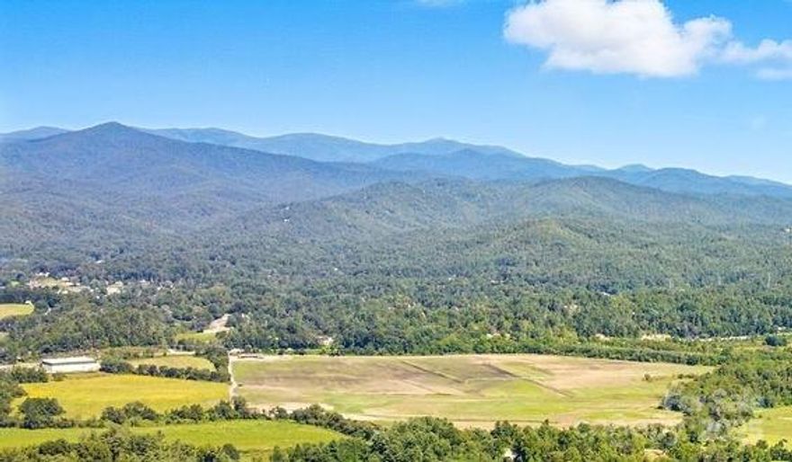 Discover an extraordinary offering in one of Pisgah Forest’s most coveted private communities. This magnificent 14.97-acre homesite captures views of Mount Pisgah, Looking Glass Rock, Pilot Mountain and more. Nestled within The Reserve—renowned for its beautiful homes and sweeping mountain vistas—this property offers a rare blend of privacy, grandeur, and natural beauty. With an established water well, an approved 4-bedroom septic permit and a topographic survey already completed, this property is ready for your custom estate. Whether you envision a serene mountain home or a sophisticated vacation getaway, this property offers boundless potential. Known as the “Land of Waterfalls,” Brevard offers charming shops, vibrant local restaurants, a thriving arts and music scene, and endless opportunities for outdoor adventure in nearby Pisgah National Forest and DuPont State Forest. Whether you're drawn to hiking, biking, fishing, great live music, farm-to-table restaurants or simply enjoying the peaceful mountain lifestyle, this location offers it all. Come build your sanctuary in one of Western North Carolina’s most beloved mountain towns!