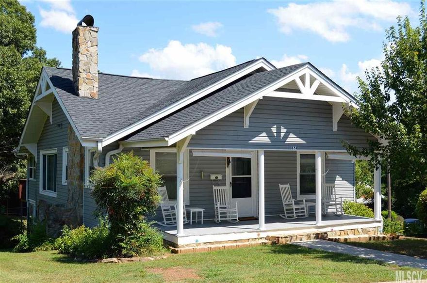 This absolutely charming home in the heart of Hickory has been thoughtfully remodeled combining the character of the period details of it's original construction with modern conveniences. The welcoming front porch expands the entire front facade of the home & is wide enough to comfortably fit multiple rocking chairs. Beautifully re-finished original hardwood flooring extends throughout. The living room features a brick fireplace flanked by built-in shelving & French-style doorway entry into the large dining room that boasts a picture window & original built-in hutch. The well appointed kitchen features custom cabinetry w/soft closing features, nicely sized pantry, sleek fixtures & upgraded appliances. The full bathroom has been stylishly updated with sleek new flooring, fixtures & tile surround. The backyard is fully fenced-in & primarily cleared. A detached garage offers an overhead door & 100 amp electrical service.  A second building offers additional storage potential.