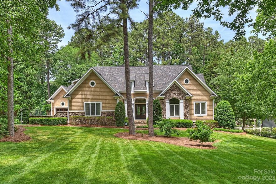 Golf course living in this 3-bedroom ranch with bonus room over garage. Septic is approved for a 4 bedroom home. This well maintained ; move in ready home is perfectly situated in The Point on Trump National Golf Course Charlotte- Hole #5.  The large kitchen features stainless appliances, 2 dishwashers, 2 ovens, beverage cooler & is open to great room & keeping room, which makes for great entertaining. Primary suite features luxurious bath, with heated tile flooring and easy access to the laundry room. Walk out of your owner’s suite to the back flagstone terrace overlooking the pristine Trump Golf Course. This home has been well loved - please see home features in attachments.  Home also includes a deeded boat slip which is just a short walk from the home.