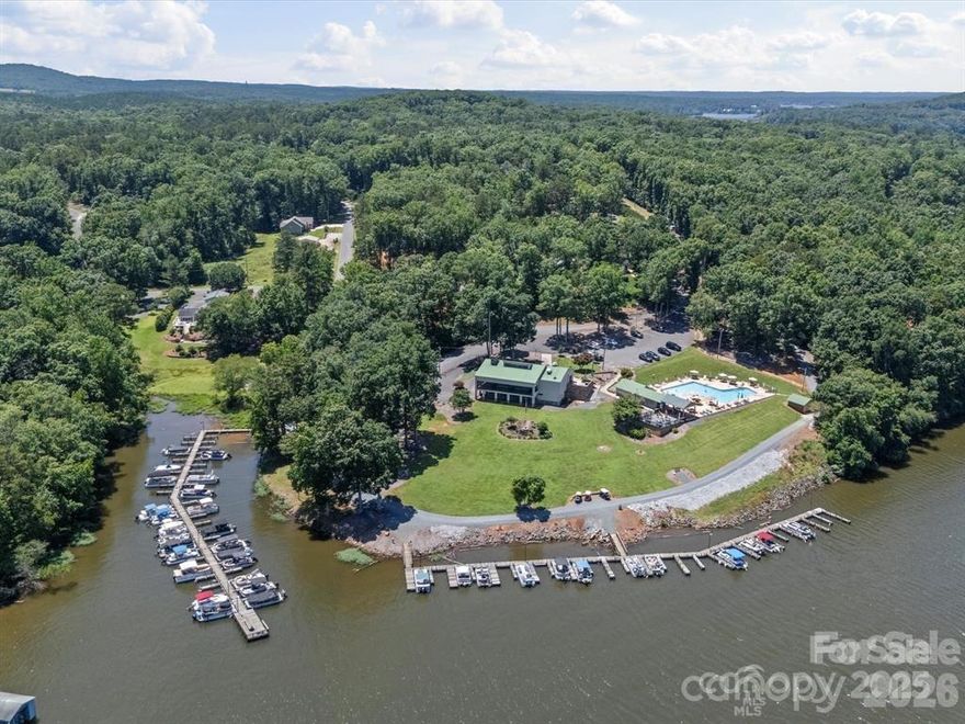 ***PRICE ADJUSTMENT*** Beautiful wooded 1 acre lot in a gated community with access to Lake Tillery, a clubhouse, community pool, tennis court, and boat docks.  Originally 3 (1444, 1445, & 1446) lots, they were combined into one in 2018.  Soil tests done in 1997 on lots 1444 and 1446 deemed unsuitable. Lot 1445 shows no records of a soil test. All agents must have business cards to show the gatekeeper in Woodrun.