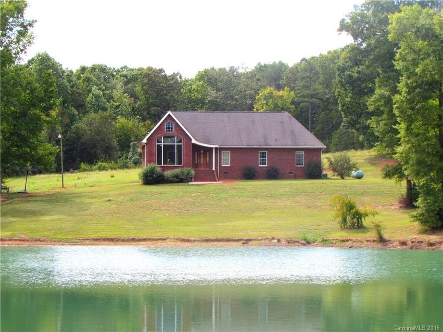 Thinking of making the move to quiet country living? Wondering what it must be like to wake up to a gorgeous view of a serene pond every morning? Let this house be the answer to those questions for you. This stunning, full brick charmer sits on just over five acres of gorgeous, wooded land. Complete with three bedrooms, two and a half baths, and almost 2500 square feet, this one is just waiting to be your dream home. Let nature be your backyard and come see this beauty today!