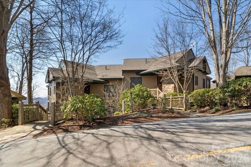 Breathtaking long-range mountain and sunset views from this beautifully maintained lower, two-level, 3-bedroom, 3-bath Austin View Villa at MOUNTAIN AIR. Designed for both comfort and entertaining, the home features a spacious, light-filled living and dining area with a stunning stone fireplace, seamlessly connected to a screened porch—also with its own fireplace—perfect for enjoying cool mountain evenings. The well-appointed kitchen is a cook’s dream, offering great space, granite countertops, a central island, breakfast nook, and an abundance of windows that fill the space with natural light. The main level includes a generous primary suite with direct access to the deck and sweeping views, along with a guest bedroom and full bath. The lower level provides excellent flexibility with a second primary suite and a den/office—ideal for guests or a private retreat. Step outside to expansive decks on both levels and take in the incredible panoramic valley and mountain vistas, along with truly unforgettable sunsets. Located just moments from Mountain Air amenities—including dining, golf, tennis, pickleball, fitness center, hiking trails, runway, and golf learning center—this home offers both convenience and lifestyle. Club membership is available separately. Offered mostly furnished (with seller exceptions; artwork does not convey), this villa is move-in ready and meticulously cared for. Enjoy cool summer temperatures, low humidity, and all that mountain living has to offer. Seller may contribute up to $20,000 toward the buyer’s social club membership initiation fee at closing with an acceptable offer.