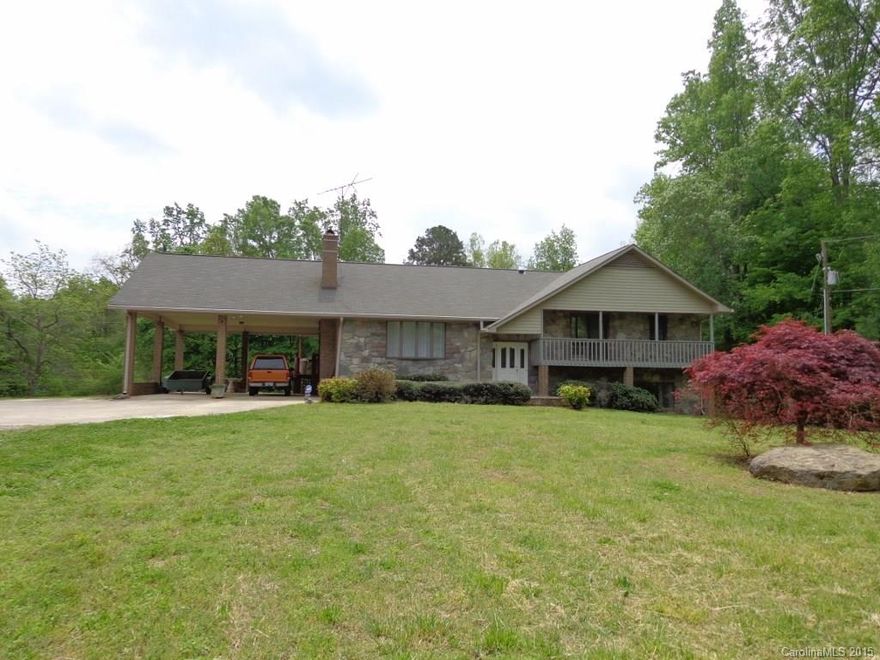 Serene and surrounded by 60 acres of trees and pasture, this beautiful stone/brick home boasts 3 bedrooms, 2.5 baths and a finished walkout basement. Beautiful views of the 5 acre stocked lake w/dock and boat launch can be seen from the formal dining room, kitchen and master bedroom. To keep energy costs low, this home was built with 2x6 walls and double insulation helping to maintain a constant indoor temperature. Additional energy saving features include 2 wood burning stoves,