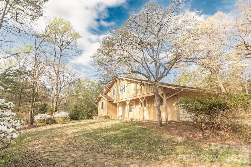 An exceptional opportunity to personalize and make this distinctive property your own. Ideally located on Maple Creek Road, just over a mile from Hwy 64/74A, this home offers the tranquility of a country setting while remaining conveniently close to Rutherfordton and its dining and shopping amenities.
Upon entry, you are welcomed by a raised living room to the left, featuring exposed wooden beams, a striking rock fireplace, and a large picture window that fills the space with natural light. To the right, a cozy den offers a second fireplace and built-in shelving, creating an inviting retreat. Adjacent to the living room is the dining area, conveniently located near the kitchen. The living room, den, and dining room all showcase beautiful hardwood flooring.
A versatile bonus room provides additional living space, ideal for a game room, family room, or home office. The spacious kitchen is well-appointed with an electric cooktop, dual ovens, granite countertops, ample cabinetry, a pantry, and a charming breakfast nook. French doors open to a patio area, perfect for outdoor entertaining. A half bath and laundry area are conveniently located just off the kitchen, with ceramic tile flooring throughout these spaces.
Upstairs, you will find three generously sized bedrooms and two full bathrooms. The primary suite features an ensuite bath with granite countertops and a walk-in closet. An additional storage area is accessible from one of the secondary bedrooms.
The basement includes a wood-burning fireplace, offering additional potential living or recreational space.
Situated on approximately 4.86 acres, the property is adorned with azaleas and mature landscaping, providing both beauty and privacy. Outdoor features include front and rear porches, a patio, a fenced backyard, and an additional fenced area ideal for pets.
This home is full of unique character and potential—schedule your private showing today to experience all it has to offer.