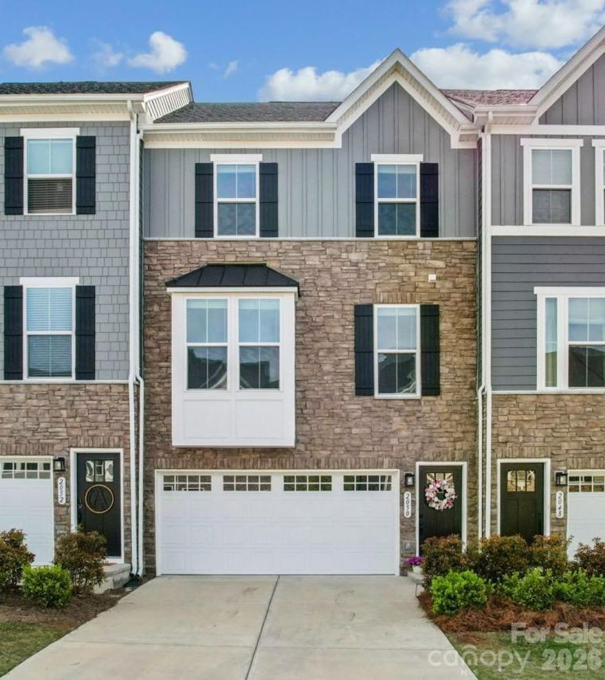 This beautiful townhome with a fabulous open floor plan is perfectly located at the end of a cul-de-sac with no neighbors behind. The main living level includes a large open living room with powder room and leads into the kitchen which includes a gas range, stainless steel appliances, large granite island, pull out shelves, double size pantry, & a deck for outdoor living & grilling. The bedrooms, full bath, & laundry room are located on the upper floor. The large primary bedroom with en-suite tiled shower, linen closet & walk-in closet offers tranquil views overlooking green space behind home. The laundry room allows ample space for storage. The secondary bathroom includes an upgraded tiled bath. The lower level includes a custom drop zone, spacious flex room area, extended patio, & 2 car garage. Great location for those who enjoy walking to restaurants, bars, retail, and supermarkets. Walk to lake and Catawba Park. New Tega Cay Main Street with mixed retail, restaurants, & entertainment venues is one block away. Currently zoned for Gold Hill Elementary & Middle, & FT. Mill High. $600 Appraisal Credit for qualified borrowers with our preferred lender. Perfect blend of city & outdoor living. Seller is offering $5,000 in concessions with acceptable offer. A great opportunity to put money towards closing costs, painting, moving expenses, or projects.