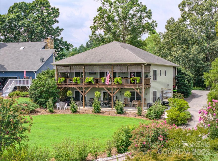 Big Open Water Views from 1280 square feet of Covered Deck, as well as Living Room, Bedroom and Kitchen. One of Lake James best water view homes and also on Marion Lake Club Golf Course. End of the street living with Members Boat Slip option, just a couple hundred yards away for easy/convenient access to the water from the Lake Club Members Marina. Enjoy year round water views of one of the cleanest Lakes in North Carolina with a beautiful, well maintained Mountain Golf Course in your front yard. Live your best life of  natural beauty, water activities and outdoor paradise  in this 3 bedroom/3 bath home with oversized garage large enough for a workshop and parking. Open floorplan allows for abundant natural light and great views throughout the home. Well landscaped property offers elevated views to the Lake with gently slopping access to the water. Outdoor living space provides year round enjoyment of sunrises and beautiful moonscapes glistening on Lake James. Mountain Lake Living at its best! Recently connected to County Water system.