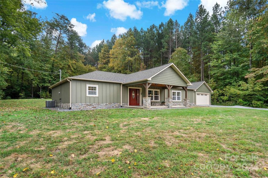 GORGEOUS 2 BR/2BA home with large open great room, laundry/mud room, oversized garage, and YOUR DREAM KITCHEN!  Located in the Montford Cove area of Marion with mountain views, and end of the road privacy.  This home was formerly the Montford Cove Community Center and was fully remodeled in 2021 with exquisite finishes, new septic, well, wiring, plumbing, insulation, and much more!