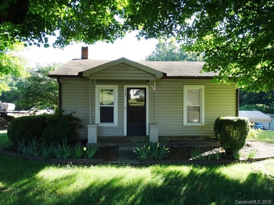 Well-kept bungalow on .72 Acre lot zoned Industrial on Sweetwater Rd. Great for first time buyer or investor. Vinyl exterior, replacement windows, new carpet & vinyl flooring, new paint throughout. Large kitchen with range & refrigerator & dining area. Separate laundry area. Updated bathroom. Den/office area, front LR & 2 bedrooms. Partial basement with exterior access. Single carport, circle driveway & storage building. House is on septic tank now but sewer is available at the street.