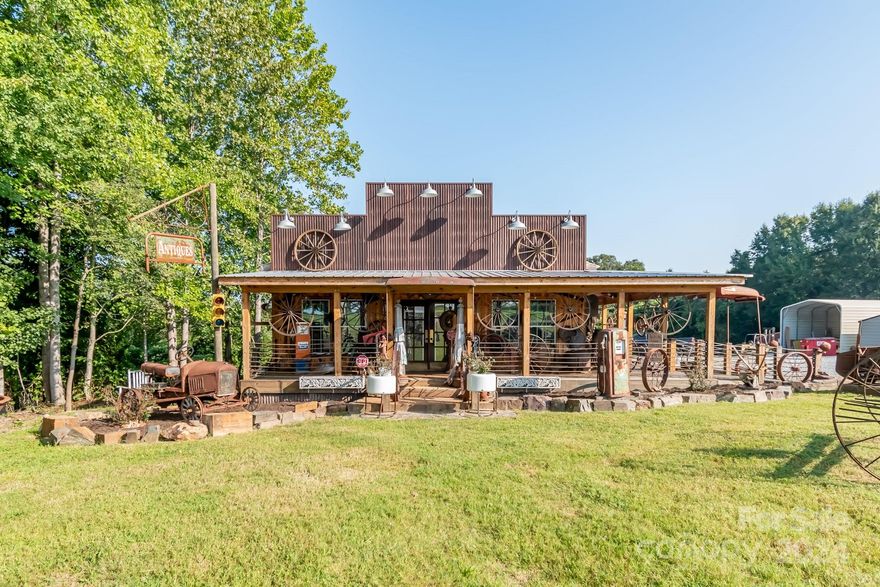 Welcome to an Incredible equity opportunity! This property has everything you need to run one or more businesses with the luxury of having a small apartment in back of the gorgeous newly built custom shop. Boasting 4.28 acres in a prime location (E Dixon) the possibilities are endless. Inside of a beautiful double ended electric and stone gate lies an office building, huge workshop equipped with a wood burning stove, ventilation and electricity, two covered carports, a detached garage, a large storage unit and a stunning one of a kind custom built store. There was no detail missed with design when procuring this compound. The property comes with a double sided billboard that can be rented out for even more income. With hundreds of vehicles passing by per hour this property is in a premiere location. Bring your imagination,business and invest in this piece of prime real estate.This listing is doubled on the MLS under commercial (mls#4184156)