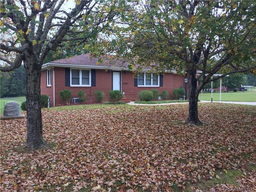 Beautiful brick home with full basement setting on a 1/2 acre lot in the Country, but close enough to everything. Main level consists of Large living room with beautiful hard wood floors, 2 bedrooms, Large remodeled bathroom with tiled floors and large tiled shower, Kitchen with tons of cabinets and counter space(appliances to remain with property) overlooking back yard, Den with fireplace(gas log insert) and laundry room.   Basement large area with rooms and full bathroom MUST SEE HOME