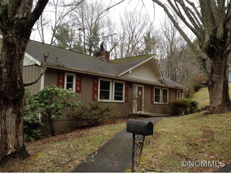 3 bed/2.5 bath home just north of Asheville w/ easy access to I-26 and amenities.  Features of this home include a living room w/ fireplace, eat-in kitchen, back-deck overlooking peaceful wooded view, walk-out/daylight/finished bsmt, single-car garage/workshop, large carport, and more.  Ready for new owners to move in and make it their own!