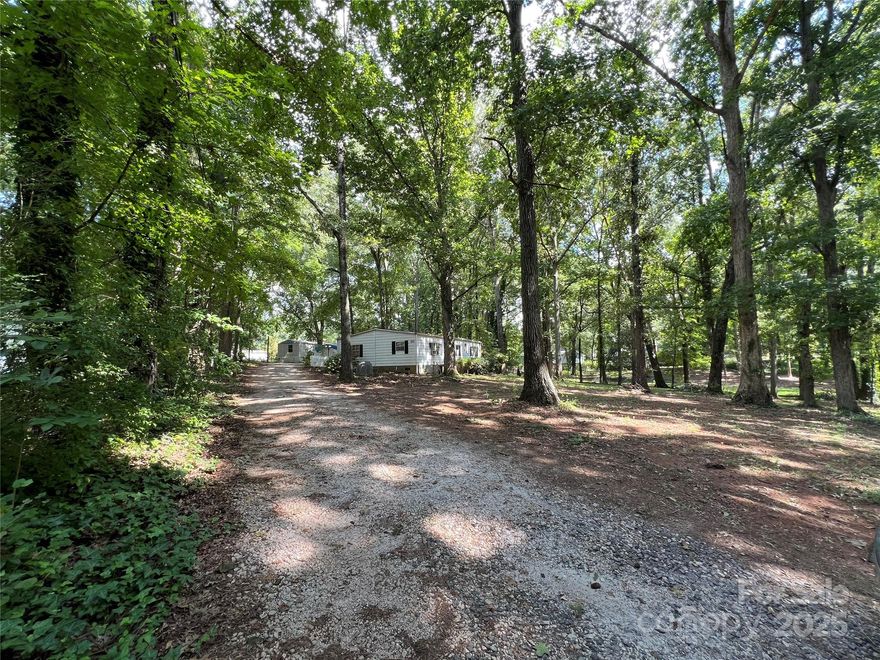 Motivated Seller! Two Mobile Homes on a beautiful & shaded 0.99-Acre Lot – 1406 & 1408 Hinson Lane. FIXER UPPER DELUX- while they are sold “as is,” the possibilities are endless. **They are both in need of TLC- new floors including subfloor, paint, misc. wall repairs, ceiling in the double wide etc. they haven't been renovated in a very long time, if ever....... Great location! Conveniently located in Rock Hill, near shopping, medical centers, restaurants, and less than 5 miles from Winthrop University and Miracle Park. Both homes share a well and septic system. With power still active and the homes having been lived in recently, this property is primed for someone with renovation skills or a desire to invest in the area.