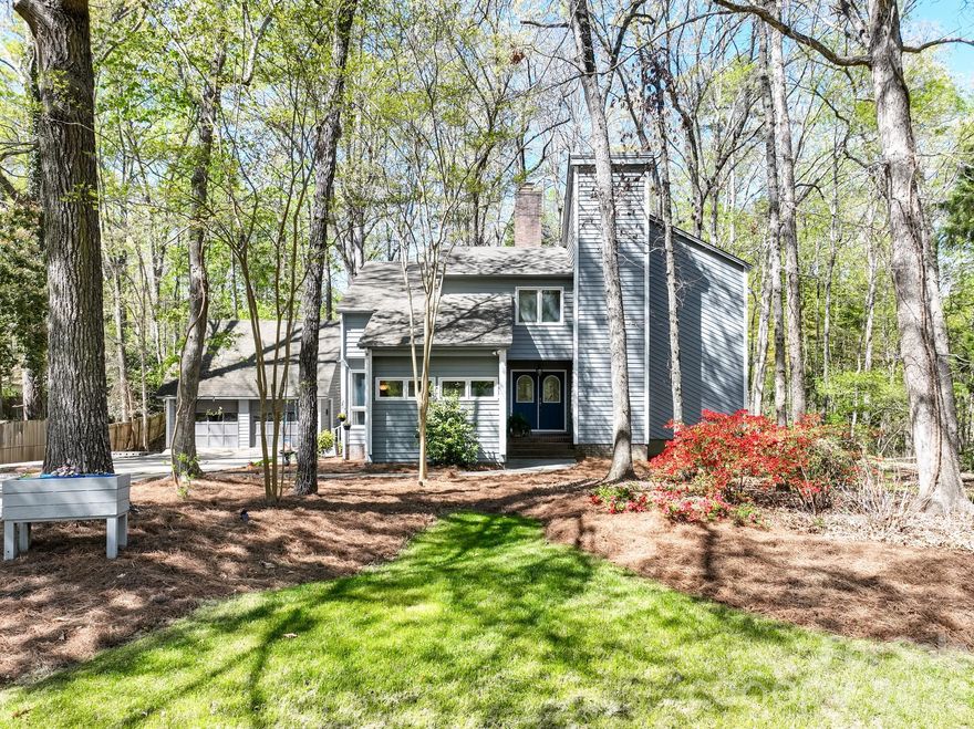 This Beautiful 4BR, 2.5BA, 2,400 Sq Ft, "Owners Suite on Main" Home, on more than 1/2 Acre in Gorgeous "Wood Forest" is a Must See!!  Lovely landscaping w/a huge covered/screened-in back porch & additional lower level deck is perfect for morning coffee and or entertaining friends & family! The first floor offers hardwoods in the entryway, a sunken living room w/luxury vinyl plank flooring, centered around a large stone fireplace, nice kitchen w/lots of cabinets for storage, SS appliances, pantry/utility room & a large private dining room & den!  The owners suite features new carpet & new BA suite w/DBL vanities w/quartz counters, a large walk-in shower w/tile surround & big walk-in closet!  Upstairs are 3 additional bedrooms (all w/large closets), full bath, laundry closet & attic storage.  Outside is a detached two car garage/workshop, the private, tranquil setting in back & front is wonderful!  The location is excellent, approximately 30 minutes to Downtown Charlotte & or the Charlotte Airport, just minutes to the Rock Hill Aquatics Center, Winthrop University, Restaurants, Shopping, Lake Wylie and Much More!