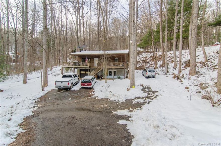 This 3/2 Arden home features new roof & skylights, new dishwasher & gas stove, new HVAC, insulated double french doors & double pane windows, open floor plan & lots of natural light. Large wooded lot gives the home a private, mountain feel, while still being close to all of Arden's conveniences. Lower level boasts convenient laundry area & extra living area. Plus, enjoy easy entertaining on the expansive wrap around deck & warm up by the new zero clearance wood stove. Includes Home Warranty!