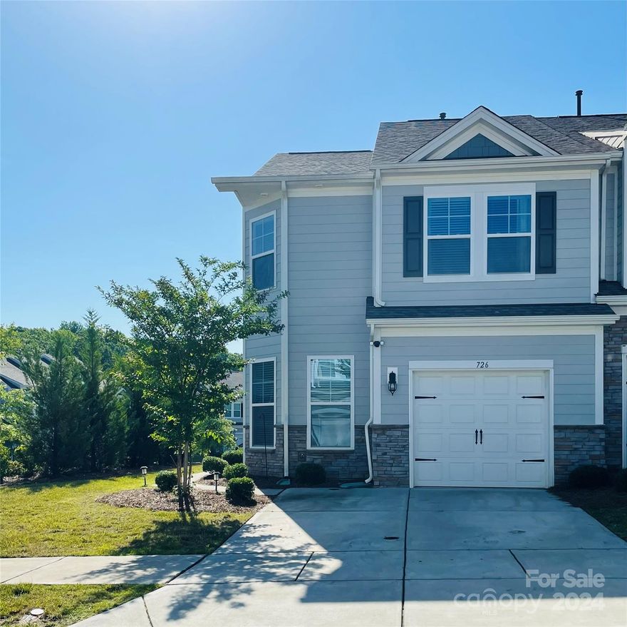 This upscale Corner Unit Lake Wylie townhome features an open floor plan,with luxury vinyl plank flooring throughout the main living area. A beautiful  kitchen includes gas range,granite countertops,SS appliances,subway tile backsplash, pantry,& island. Designated office and half bath complete the main floor. Travel upstairs to the oversized primary suite w/ walk-in closet,along with the large tile shower & dual vanities. This popular floorplan has two additional spacious bedrooms on the opposite side of the upper level with a laundry room located in the middle for convenience. Maintenance free living at its best, w/ waste collection,pest control,irrigation,& landscaping included in the HOA dues. Minutes from Lake Wylie, and everything that lake life has to offer. Double Driveway,Low SC Taxes,Award-Winning School District and close proximity to Charlotte .Enjoy the many community amenities to include:Outdoor pool,Clubhouse,Picnic/Grilling area,Playground,Gym, Bocce&Pickle Ball Courts.