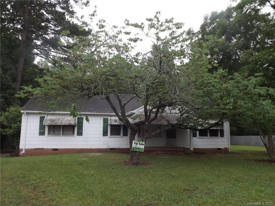 Great  opportunity!  TLC is needed but there are 3 bedrooms, a formal living room and a den.  Large rocking chair front porch with a huge wooded lot.  A must see property!  “Bank of America, N.A. employees and employees’ household members (including persons deriving their primary means of financial support from a Bank employee), and HTS business partners of the bank are prohibited from purchasing this property, whether directly or indirectly”.