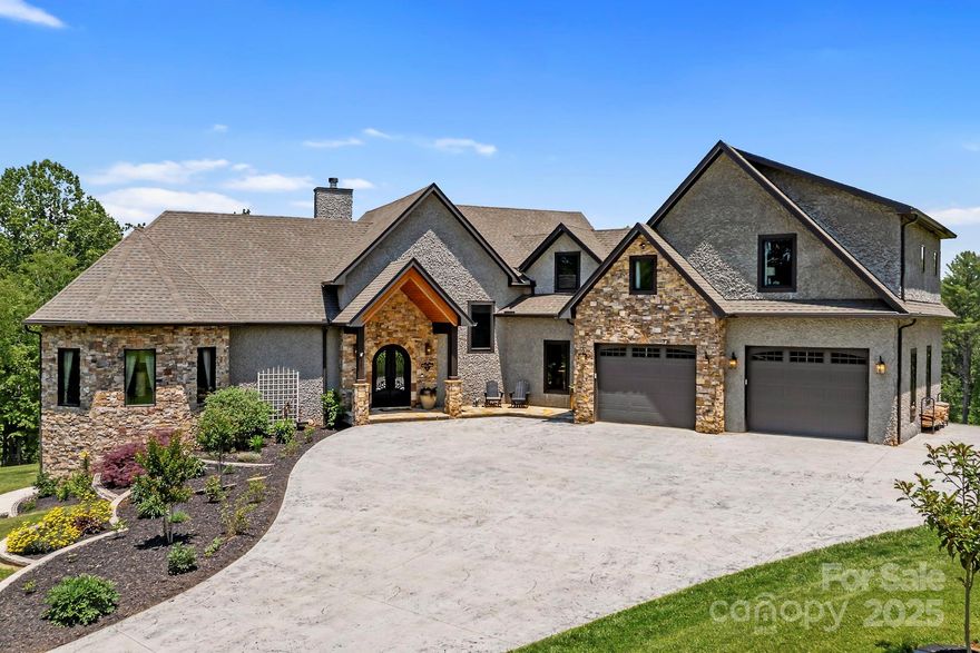 An exceptional masterpiece of craftsmanship and design, this custom luxury estate was built with uncompromising quality and attention to detail. Rich hardwood floors, custom maple cabinetry, and exotic granite surfaces set the tone for refined elegance. The main level features a dramatic two-story great room with a stacked stone fireplace, chef's kitchen, and a luxurious primary suite with a spa-inspired bath. Upstairs offers 3 bedrooms, each with its own ensuite bath. The lower level is ideal for guests or multigenerational living w/a separate entrance, parking & garage, kitchen, living room, 2 bedrooms, 1 1/2 baths, and laundry. Step outside to an expansive back deck—an outdoor oasis perfect for entertaining or relaxing. Enjoy a custom-built sauna. Set on 10+ acres with unlimited room for your horses, goats & chickens, and multiple potential build sites, this isn’t just a home—it’s a lifestyle, a sanctuary, and a rare chance to disconnect from the ordinary and live extraordinarily.