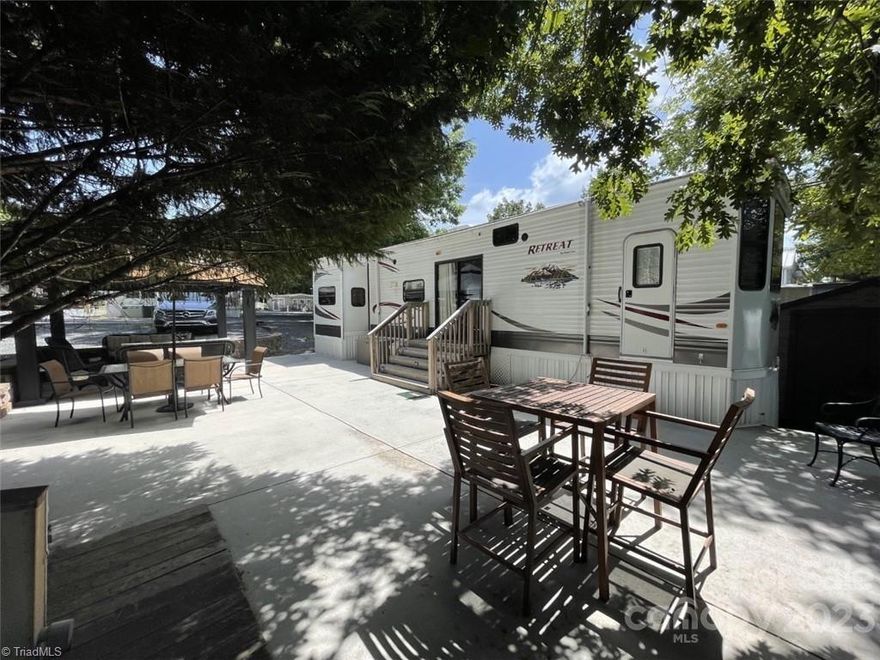 Discover your ideal getaway in this 2-bedroom, 1.5-bath destination camper nestled within the community of Badin Shores Resort. Set on a deeded lot, this charming retreat offers a comfortable haven for relaxation. Step outside onto the inviting concrete patio with a gazebo, perfect for alfresco dining and social gatherings. Inside, the main bedroom features a king-size bed & built in storage while the 2nd bedroom offers an attached 1/2 bath.  Enjoy the convenience of being close to numerous amenities, enhancing your leisure experience. Whether you seek a tranquil escape or a vibrant adventure, this prime location makes it an exceptional choice. Experience the essence of Badin Shores Resort living at its best.