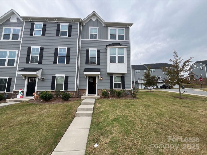 A spacious 3 bed, 2.5 bath, 1,750 sq. ft. town home with an open living area, bonus space and storage! The first floor foyer of this home leads to a bonus/rec room, storage space and the rear-loaded one-car garage.  Stairs welcome you into a sunlit, open plan living room and eat-in kitchen with a breakfast bar island.  The kitchen is adorned with stainless steel appliances, a tile backsplash, quartz countertops, modern light fixtures and a pantry.  Just off the dining area is a balcony, perfect for outdoor dining for two. Your primary suite is on the third level, featuring a trey ceiling, walk-in closet and tiled walk-in shower.  Two additional bedrooms share a second full bath, offering plenty of space to spread out, relax and entertain! Located near I-485, Brookshire Blvd., restaurants, grocers and shopping!