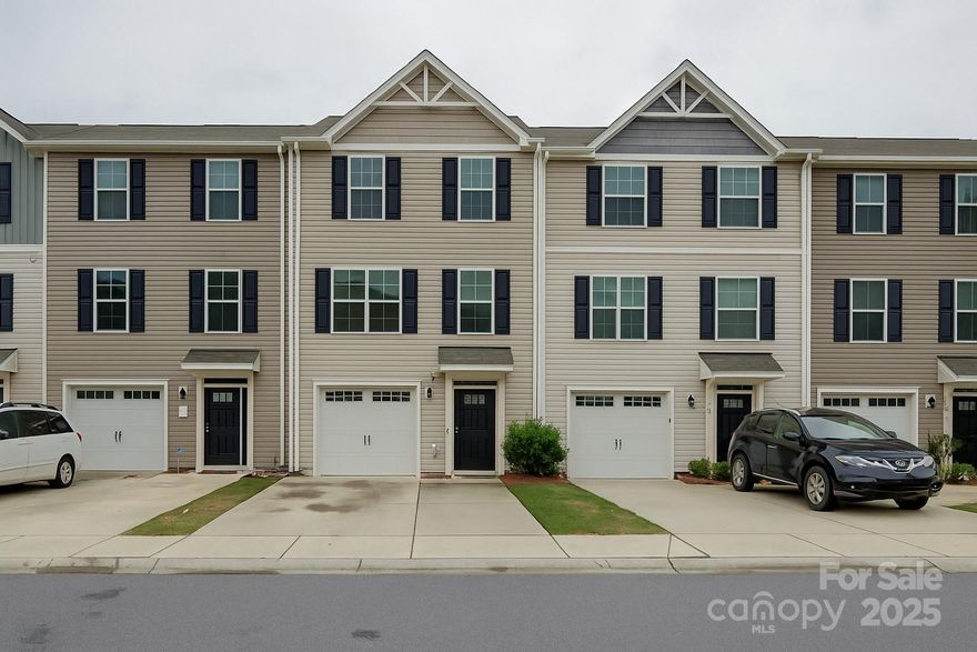 Welcome to this beautifully maintained 3-bedroom, 2.5-bath townhome located in the heart of Fort Mill! Perfectly situated just minutes from Charlotte, this home offers the ideal blend of suburban tranquility and city convenience. Head inside to find a bright and open floor plan with numerous upgrades, including a modernized kitchen featuring quartz countertops, stainless steel appliances, and updated cabinetry—perfect for entertaining or enjoying quiet nights at home. The spacious living area flows seamlessly into the dining/kitchen space, ideal for relaxing or hosting guests. Upstairs, you'll find three generous bedrooms, including a large primary suite with a walk-in closet and en-suite bath. Located in a highly sought-after community with access to top-rated Fort Mill schools, nearby parks, shopping, dining, and quick access to I-77 for easy commutes to Charlotte. Don't miss this move-in-ready gem in one of the fastest-growing areas in the Carolinas!