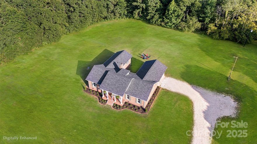 2nd chance at NO fault of sellers!  Southern Living Home on 16 Acres with pasture and trails for horses, ATVs, or watching wildlife, plus room for pool and potential to build a compound. This all-brick ranch, a prime property located between York and Rock Hill with easy access to I-77, is now fully updated throughout. It checks all the boxes with a NEW KITCHEN featuring stainless steel appliances and a built-in desk, new HVAC, new roof, updated plumbing, new windows and doors, custom shutters, fresh paint, new flooring and fixtures, remodeled bathrooms, newly landscaped grounds, and a new 2-car garage. Relax in the cozy living room or the den with a wood-burning fireplace—perfect for togetherness. Or enjoy privacy with 4 full bedrooms. Every window has views of the countryside—even the generous laundry room.  Step outside to a rocking-chair front porch, or relax in your shaded courtyard—ideal for outdoor living.  A full attic offers storage and the potential for vaulted ceilings too.