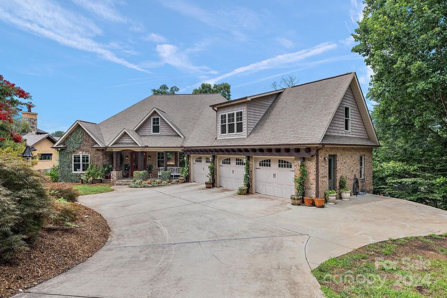 Exquisite views of Lake Hickory from every area of this 2-story home with a walkout basement. Located in a serene cove, this home sits on .58+/- acres with a multi-tiered backyard and a deep water-covered boat dock & lift. Main level formal living room, dining room, casual dining/den, enjoy lake views from every room, large island w/seating, large walk-in pantry, drop zone room with custom built ins, and dreamy laundry room! Sip coffee on the open deck or screened area oasis while enjoying expansive lake views. Main level primary bedroom, double vanity, walk-in shower, jacuzzi tub, and large walk-in closet and additional separate bathroom. Three upstairs brms with private full baths, landing area, and massive bonus/flex space. The basement offers awesome industrial design, full kitchen/bar, and an additional guest suite. We love the oversized 3 Car Garage with Additional Parking Pad for 3 More Vehicles located in Quiet Cul-De Sac location in NW Hickory.