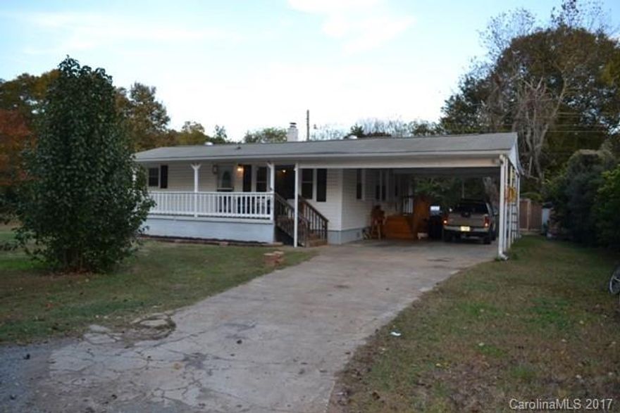 This home sits on almost an acre in Fort Mill!!  Huge rocking chair front porch, large carport, 3 outbuildings - one of which is wired.  This home offers 3 bedrooms, 2 bath, large living room, dining area and spacious kitchen.  Great access to I-77, shopping, restaurants and the airport.